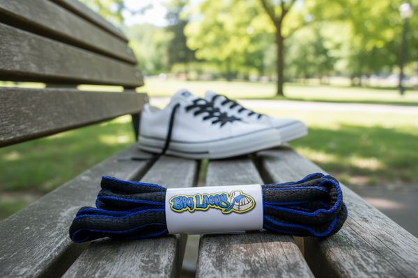 a pair of oval black and royal blue shoelaces for running shoes