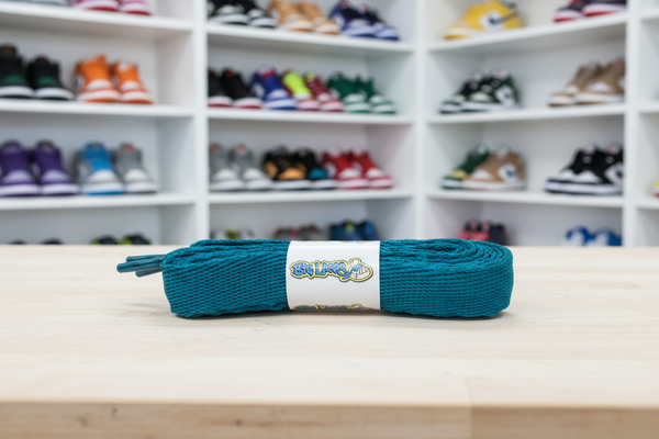 a pair of flat teal 20mm wide shoelaces

